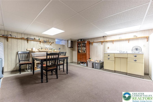 1571 Penn Dr, West Penn Twp, PA 18211 - dining area with a drop ceiling, wooden walls, and carpet floors