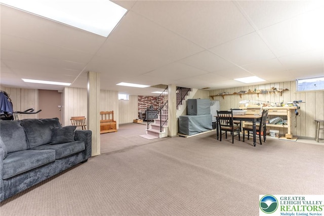 1571 Penn Dr, West Penn Twp, PA 18211 - living area with carpet, stairway, wooden walls, and a paneled ceiling