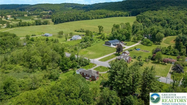 1571 Penn Dr, West Penn Twp, PA 18211 - aerial view of property and surrounding area with a heavily wooded area and rural landscape