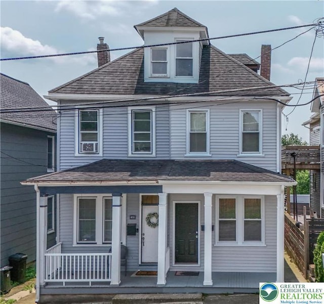 834 Bushkill St, Easton, PA 18042 - american foursquare style home featuring a porch, a chimney, and a shingled roof