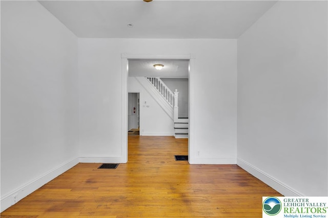 834 Bushkill St, Easton, PA 18042 - empty room featuring stairs and wood-type flooring
