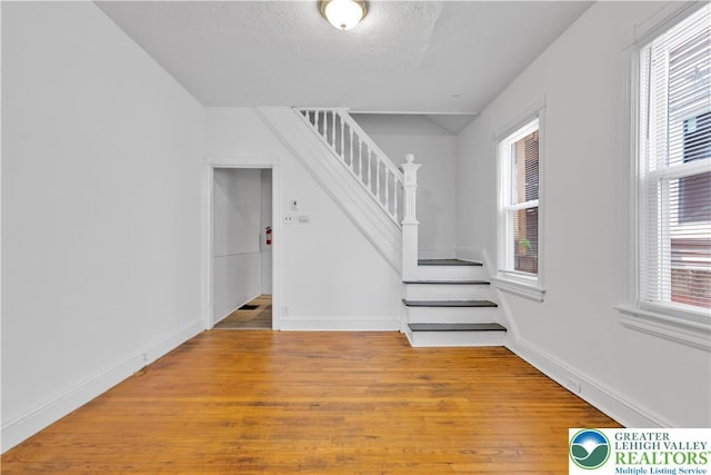 834 Bushkill St, Easton, PA 18042 - unfurnished room with stairway and light wood-style flooring