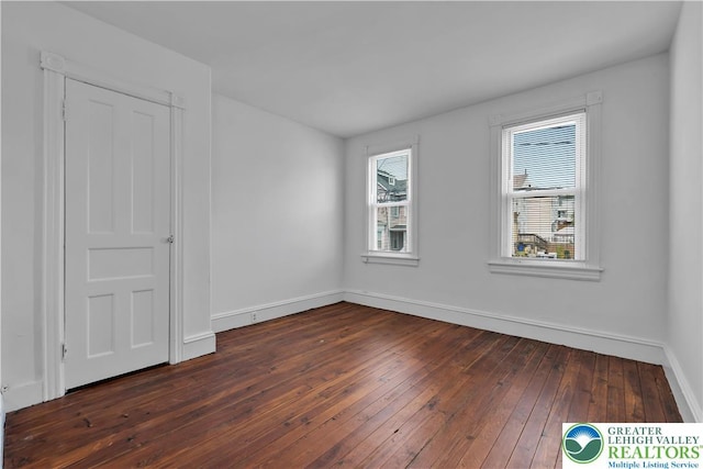 834 Bushkill St, Easton, PA 18042 - unfurnished bedroom with baseboards and dark wood finished floors
