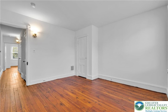 834 Bushkill St, Easton, PA 18042 - empty room featuring hardwood / wood-style floors and a smoke detector
