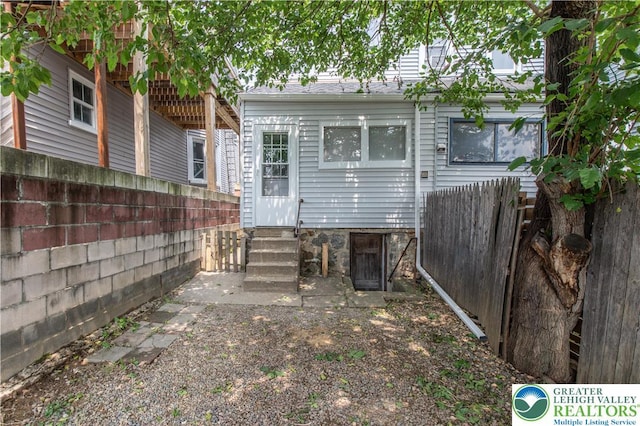 834 Bushkill St, Easton, PA 18042 - rear view of house featuring entry steps and a fenced backyard