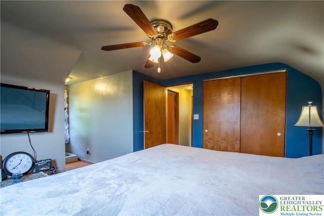 7035 Scenic Dr, Bloomsburg, PA 17815 - bedroom with a closet, vaulted ceiling, and a ceiling fan