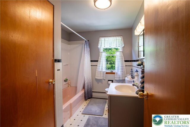 7035 Scenic Dr, Bloomsburg, PA 17815 - bathroom with vanity, shower / bath combo with shower curtain, and a baseboard heating unit
