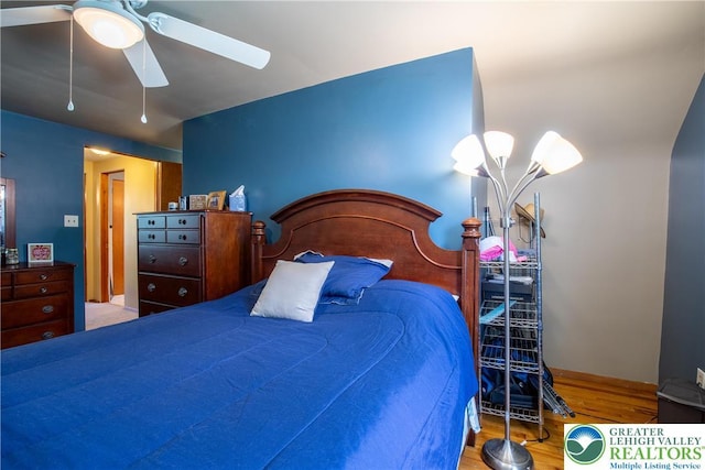 7035 Scenic Dr, Bloomsburg, PA 17815 - bedroom with wood finished floors and ceiling fan