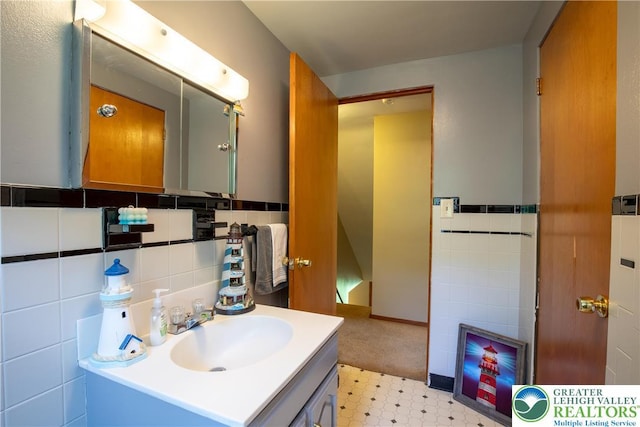 7035 Scenic Dr, Bloomsburg, PA 17815 - bathroom featuring vanity, tile walls, and tile patterned floors