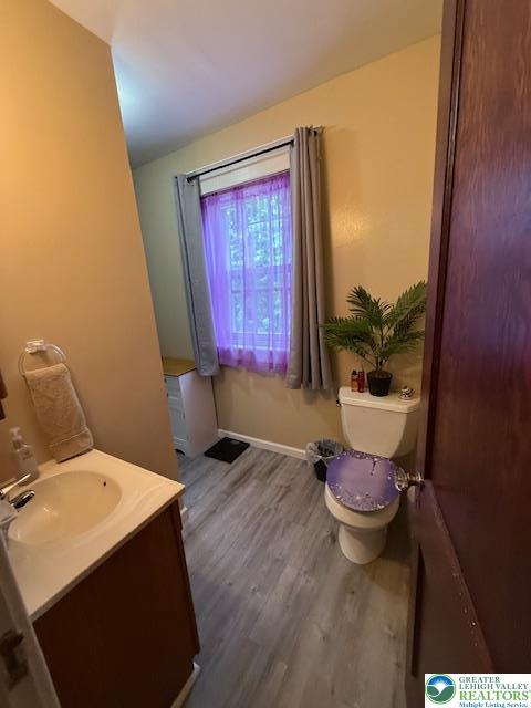 2413 Walbert, South Whitehall Twp, PA 18104 - half bath featuring wood finished floors and vanity