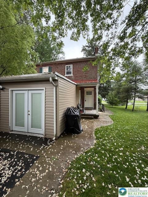 2413 Walbert, South Whitehall Twp, PA 18104 - rear view of house featuring french doors, a lawn, a patio, and brick siding