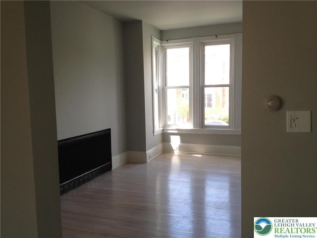 1002 Lehigh St, Easton, PA 18042 - empty room featuring radiator and wood finished floors