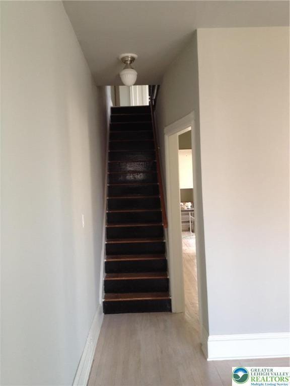 1002 Lehigh St, Easton, PA 18042 - staircase with wood finished floors and baseboards