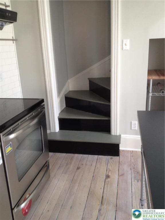 1002 Lehigh St, Easton, PA 18042 - stairs featuring wood finished floors and baseboards