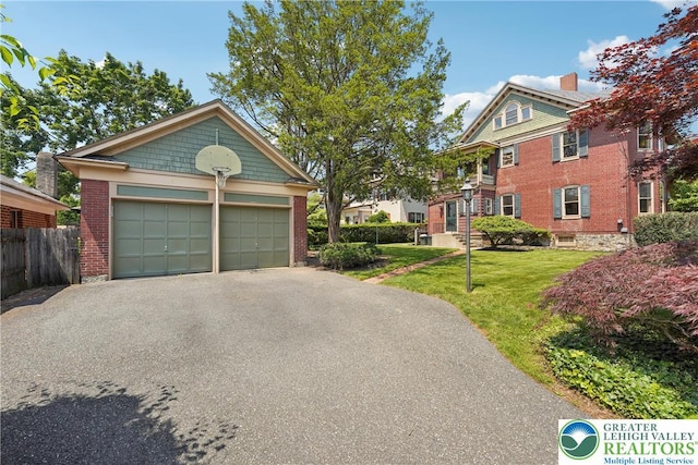 200 W Pierce St, Easton, PA 18042 - view of front of house with a garage, an outdoor structure, driveway, and brick siding