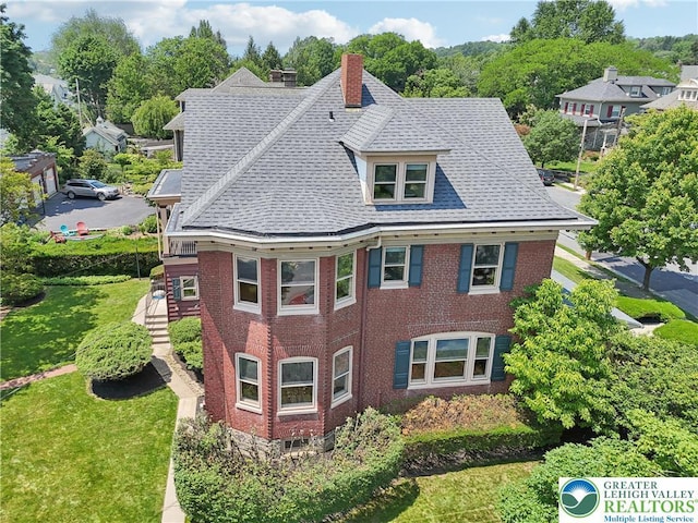 200 W Pierce St, Easton, PA 18042 - view of front of property featuring a chimney, brick siding, a shingled roof, a front lawn, and stairway