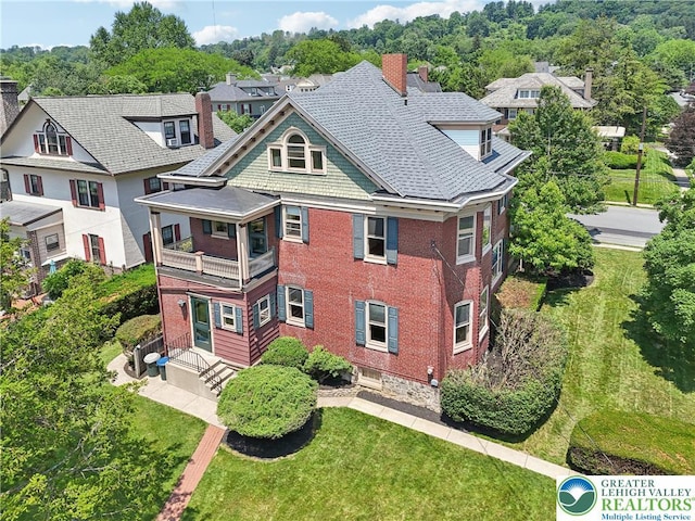 200 W Pierce St, Easton, PA 18042 - rear view of property with a balcony, a chimney, brick siding, a yard, and a residential view