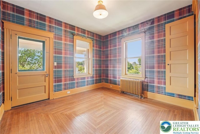200 W Pierce St, Easton, PA 18042 - empty room featuring radiator heating unit and wallpapered walls