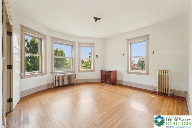 200 W Pierce St, Easton, PA 18042 - empty room featuring radiator heating unit and healthy amount of natural light