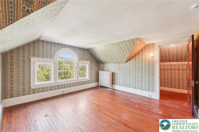 200 W Pierce St, Easton, PA 18042 - additional living space featuring radiator, wallpapered walls, hardwood / wood-style flooring, and lofted ceiling