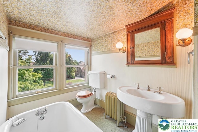 200 W Pierce St, Easton, PA 18042 - full bath with a freestanding tub, radiator heating unit, and wallpapered walls