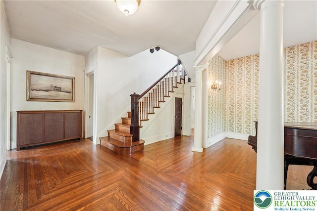 200 W Pierce St, Easton, PA 18042 - foyer with decorative columns, stairway, and wallpapered walls
