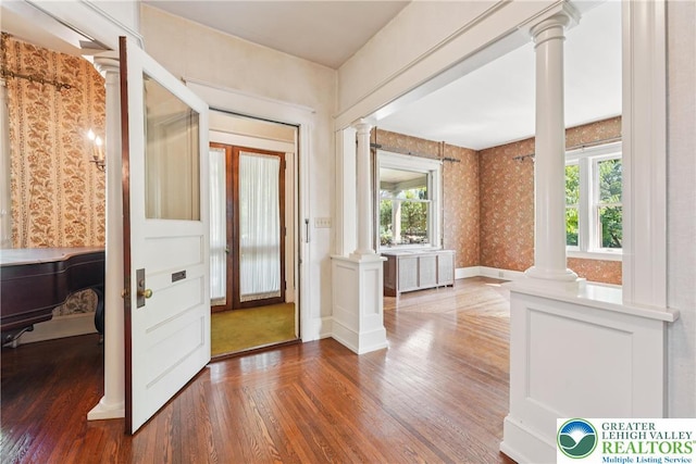 200 W Pierce St, Easton, PA 18042 - foyer entrance featuring ornate columns, wood-type flooring, plenty of natural light, and wallpapered walls