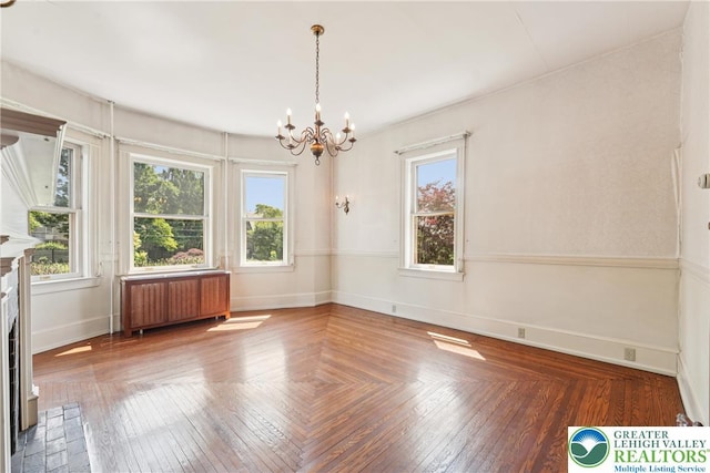 200 W Pierce St, Easton, PA 18042 - unfurnished dining area with radiator heating unit, a chandelier, and a fireplace
