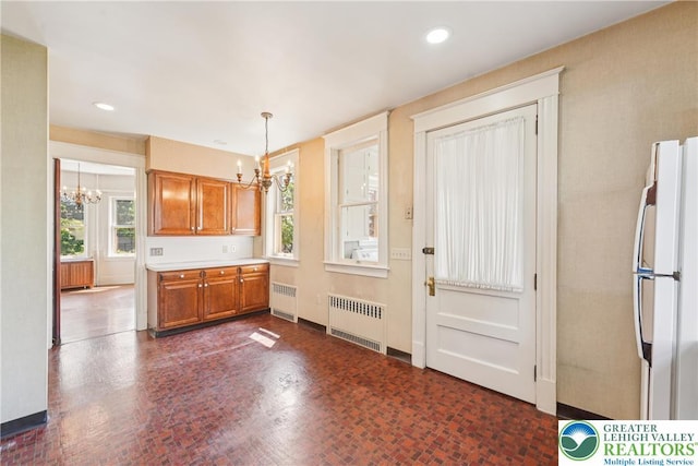 200 W Pierce St, Easton, PA 18042 - kitchen with a chandelier, radiator heating unit, freestanding refrigerator, and recessed lighting