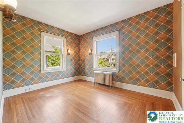 200 W Pierce St, Easton, PA 18042 - empty room featuring radiator, healthy amount of natural light, and wallpapered walls