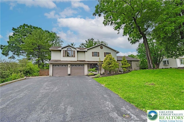 1450 Coventry Rd, South Whitehall Twp, PA 18104 - view of front facade with a garage, asphalt driveway, a front lawn, and brick siding