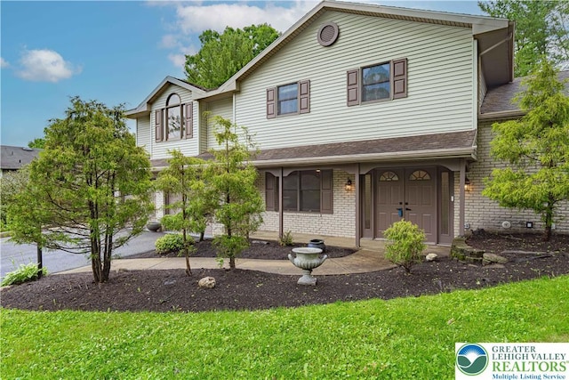 1450 Coventry Rd, South Whitehall Twp, PA 18104 - view of front facade with brick siding and a front yard