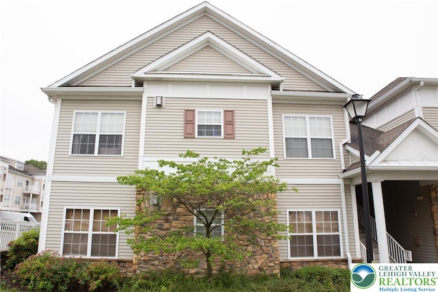607 Prestwick Dr, Williams Twp, PA 18042 - rear view of property featuring stone siding