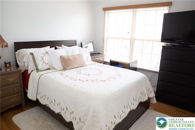 607 Prestwick Dr, Williams Twp, PA 18042 - bedroom featuring wood finished floors and multiple windows