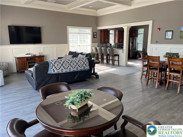607 Prestwick Dr, Williams Twp, PA 18042 - living area featuring coffered ceiling, a decorative wall, beam ceiling, crown molding, and healthy amount of natural light