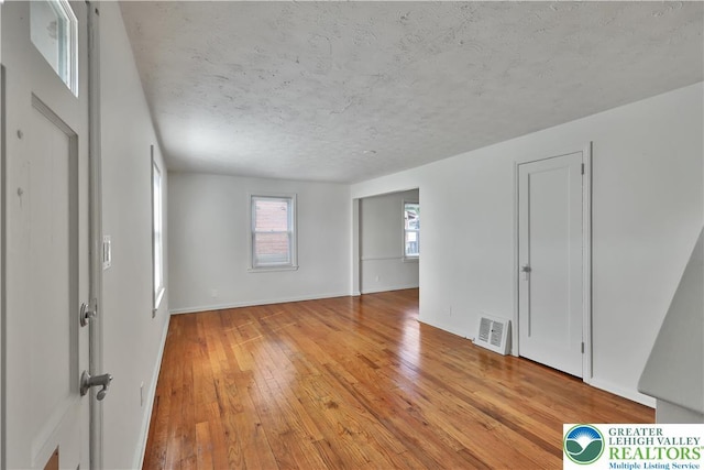 1509 Liberator Ave, Allentown City, PA 18103 - unfurnished room featuring light wood-style flooring and a textured ceiling