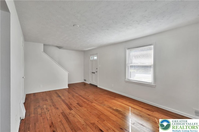 1509 Liberator Ave, Allentown City, PA 18103 - entrance foyer with wood-type flooring, a textured ceiling, and stairway