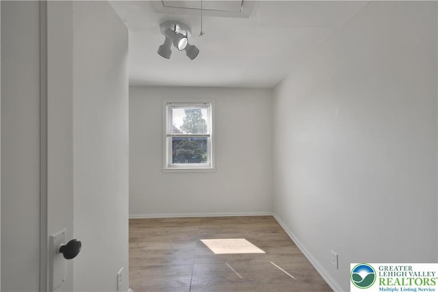 1509 Liberator Ave, Allentown City, PA 18103 - spare room featuring wood finished floors and attic access