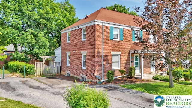 1509 Liberator Ave, Allentown City, PA 18103 - townhome / multi-family property with brick siding and driveway