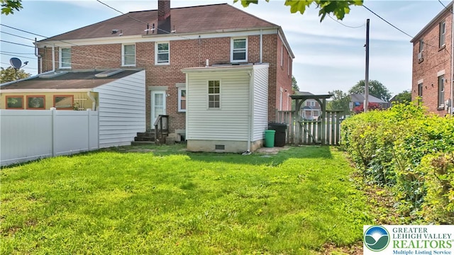 1509 Liberator Ave, Allentown City, PA 18103 - rear view of property with entry steps, a chimney, and brick siding