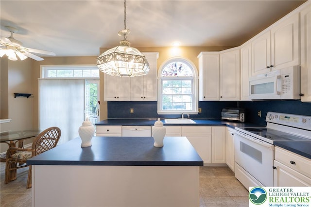 5900 Wayside Dr, Lower Macungie Twp, PA 18062 - kitchen featuring white appliances, dark countertops, ceiling fan, and white cabinetry