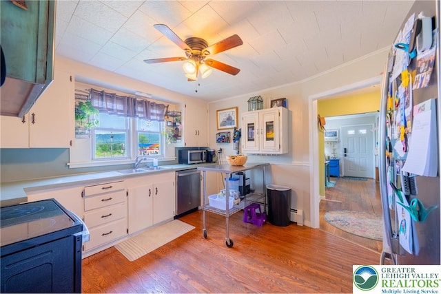 103 A St, Wind Gap Boro, PA 18091 - kitchen featuring appliances with stainless steel finishes, a ceiling fan, white cabinetry, wood finished floors, and light countertops