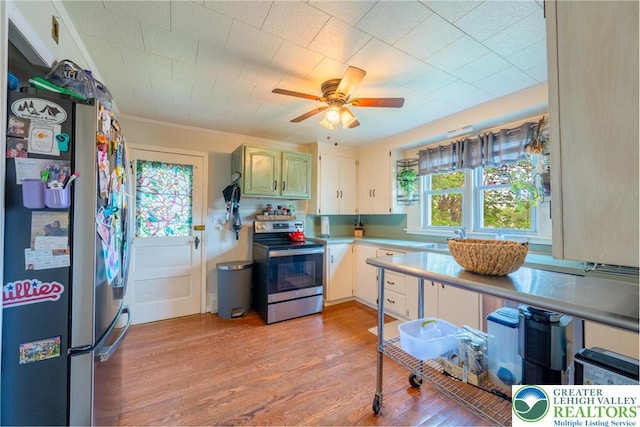 103 A St, Wind Gap Boro, PA 18091 - kitchen featuring stainless steel appliances, light countertops, a ceiling fan, and light wood finished floors