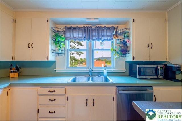 103 A St, Wind Gap Boro, PA 18091 - kitchen with appliances with stainless steel finishes, light countertops, crown molding, and white cabinets