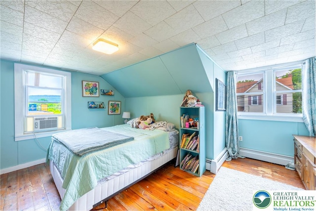 103 A St, Wind Gap Boro, PA 18091 - bedroom with hardwood / wood-style floors, multiple windows, a baseboard heating unit, and vaulted ceiling
