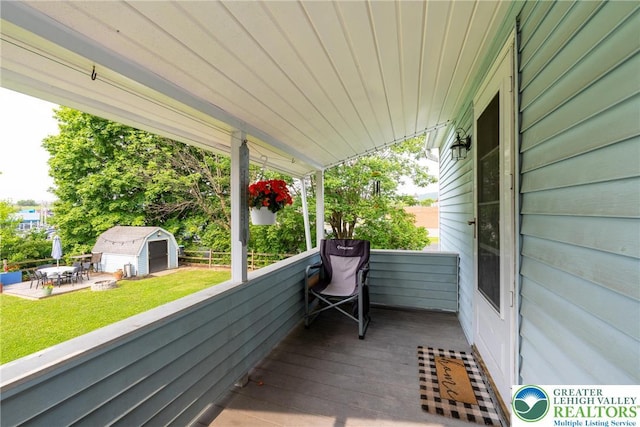 103 A St, Wind Gap Boro, PA 18091 - wooden terrace featuring an outdoor structure, a lawn, and a patio