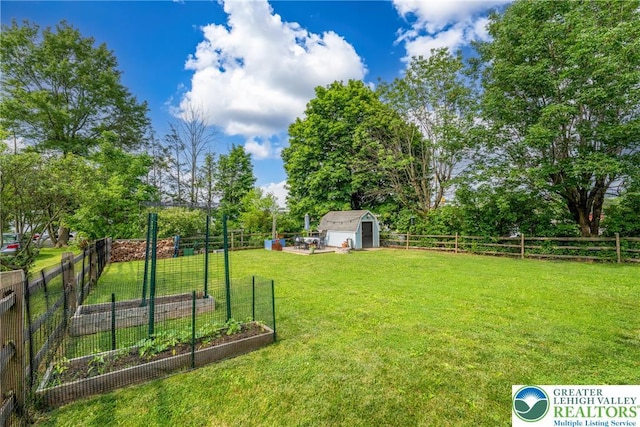 103 A St, Wind Gap Boro, PA 18091 - fenced backyard featuring a garden and a storage unit