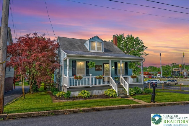 103 A St, Wind Gap Boro, PA 18091 - view of front facade featuring covered porch, a chimney, and a yard