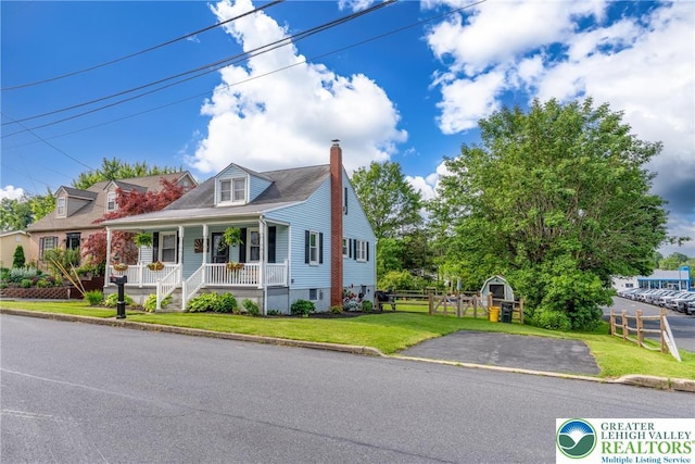 103 A St, Wind Gap Boro, PA 18091 - new england style home featuring a porch, a chimney, and a storage shed