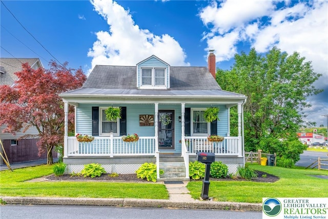 103 A St, Wind Gap Boro, PA 18091 - view of front of home with covered porch, a front lawn, and a chimney